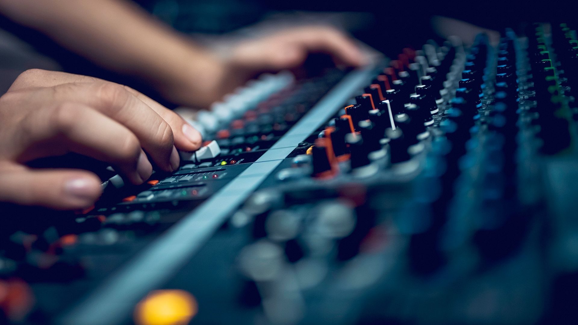 Source Hand with sound recording studio mixer
